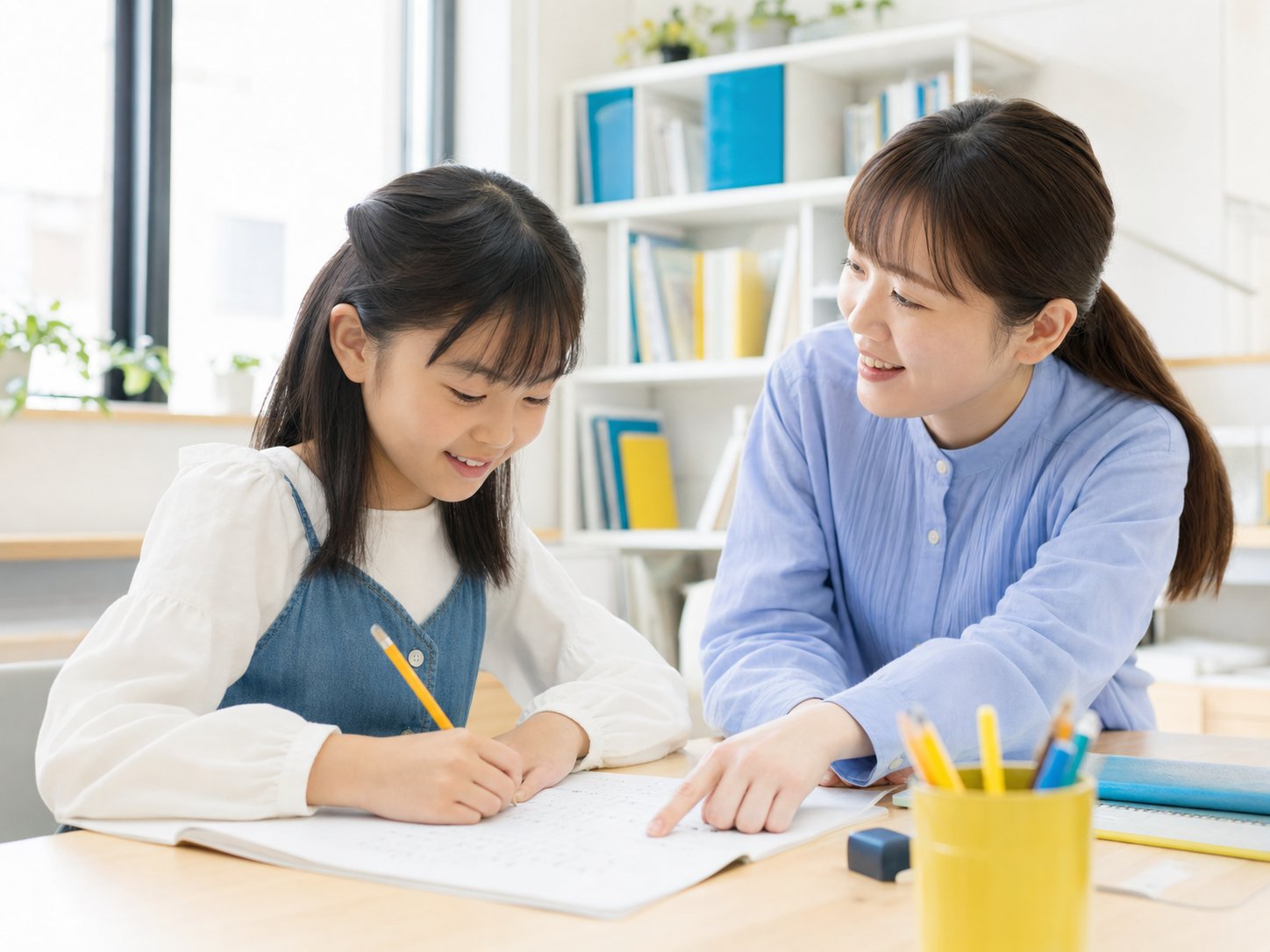 小学生に算数を個別指導する先生